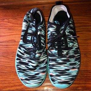 Teal, black, white, and orange Nike sneakers